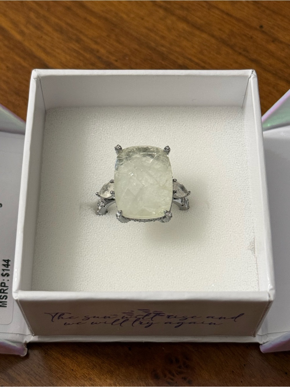 bp Silver-Tone color changing Ring with Pale Cream Cushion Stone and Side Gems